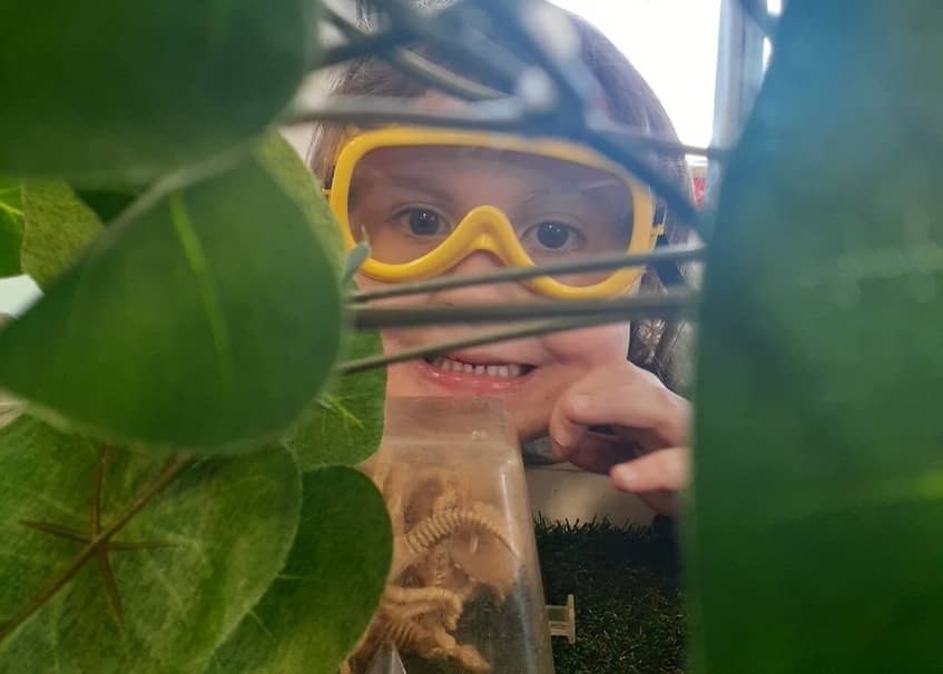 child with plants